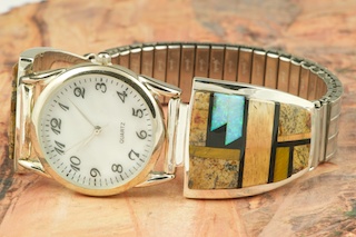 Genuine Picture Jasper and Black Jade inlaid in Sterling Silver. Beautiful Fire and Ice Lab Opal Accents.  Mens quartz watch with expandable band. Designed by Navajo Artist Calvin Begay. Signed.